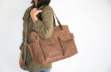 large brown waxed canvas diaper tote bag