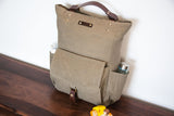 khaki canvas backpack with bottle pockets