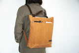 mustard yellow waxed canvas small backpack with laptop and tablet pocket
