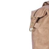 Light brown leather diaper purse in 3-in-1 convertible design. Can be carried as a backpack, crossbody and tote bag
